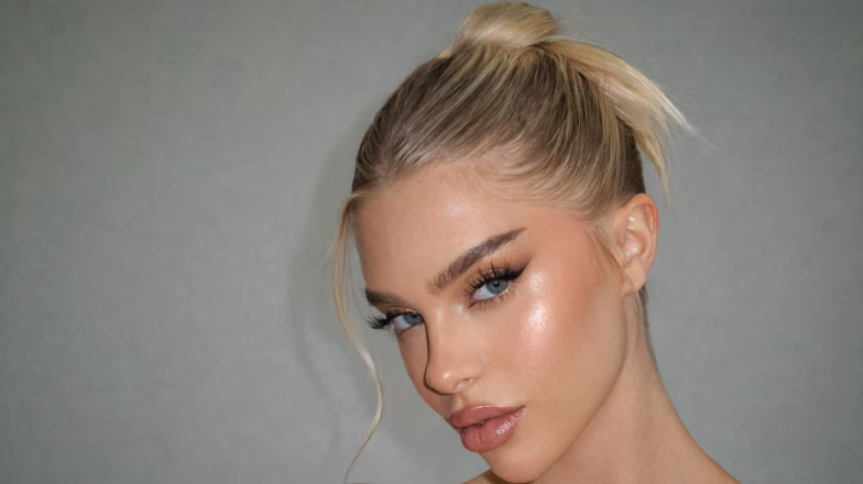 Portrait of a woman with flawless base makeup, smooth skin and natural glow finish