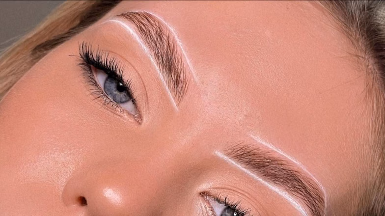Close-up of perfectly shaped and defined eyebrows after brow architecture treatment