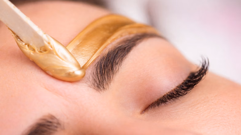 Brow lamination treatment with styling product applied to shape and fix eyebrows