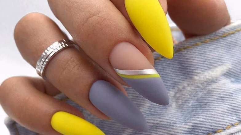 Long acrylic nails with bold neon yellow and grey color design