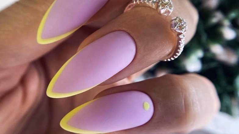 Almond-shaped nails with soft lilac base and neon outline design