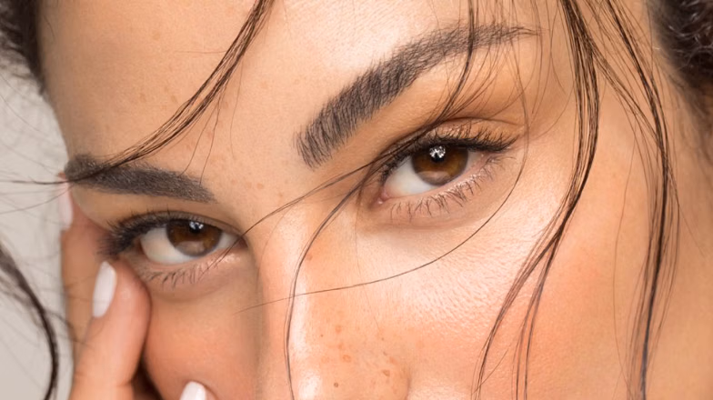 Close-up of full fluffy eyebrows showing laminated brow effect and defined shape