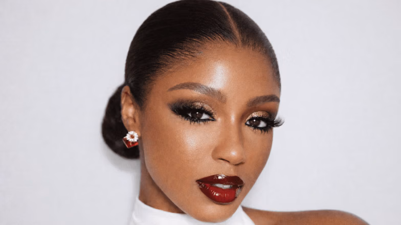 Evening party makeup with bold red lips and radiant skin